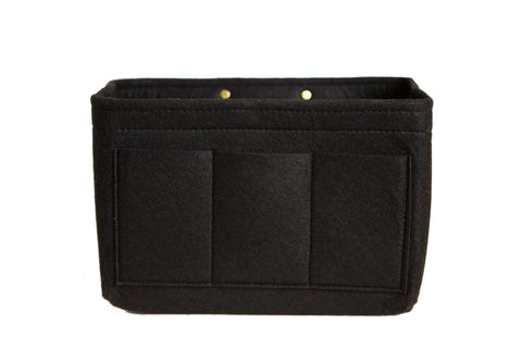 The Urban Southern Tote Insert is a rectangular black lightweight felt organizer with three front pockets and two metal snaps at the back, designed for customizable organization. Photographed against a white background.