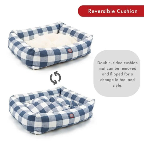 The Majestic Pet Anderson Check Luxe Bagel Bed features a reversible cushion—one side in soft faux sheepskin, the other in blue and white plaid—to easily switch up your pet’s comfort and style.