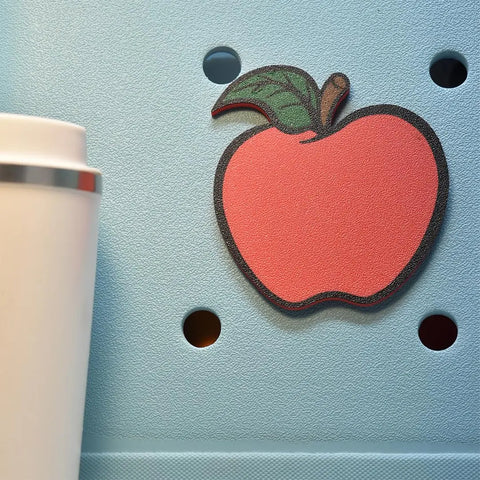 The FRESHe Baglets Teacher Charms by Chatelet Manufacturing are decorative apple-shaped charms, perfect for tote bags like Bogg Bags and Simply Southern—great as a teacher gift or fun accessory.