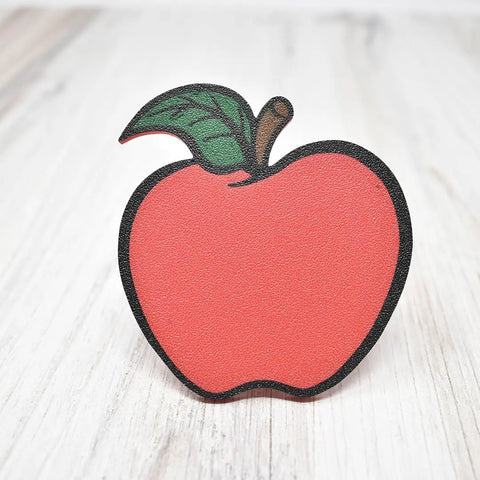 The FRESHe Baglets Teacher Charm from Chatelet Manufacturing features a cute, cartoon-style red apple with a green leaf and brown stem—perfect for decorating tote bags like Bogg Bags and Simply Southern.