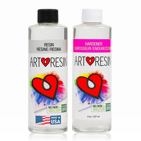 Two 16 oz (474 ml) bottles of ArtResin Epoxy Resin—Resin and Hardener—feature a colorful heart logo. BPA-free, non-toxic, and made in the USA, they include English, French, and Spanish text on the labels.