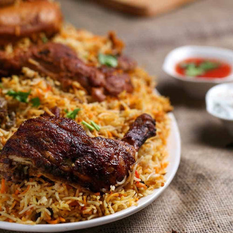 Elevate a plate of biryani with roasted chicken, herbs, and sauces by adding a sprinkle from Gustus Vitaes Painters Palette Collection - 6 Tins gourmet sea salts for an enhanced flavor experience.