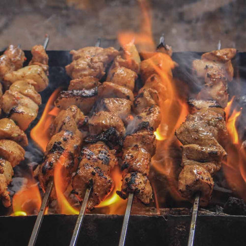 Chicken and beef skewers sizzle over open flames, turning golden brown as they’re seasoned with Gustus Vitae’s Middle Eastern Seasoning Gift Set—an artisanal six pack of rich, authentic spice blends capturing the flavors of the region.