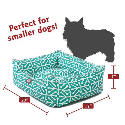 The Majestic Pet Aruba Contemporary Lounge Bed is a turquoise, machine washable bed with a white bone pattern, measuring 23x17x7. Shown beside a small dog silhouette. Text: Perfect for smaller dogs! Give your pet modern comfort.