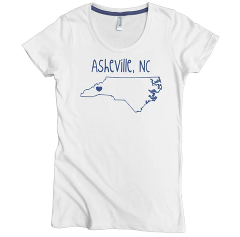 The Heart Asheville NC Graphic Tee by Spiritex | Sustainable Apparel is a white, fitted women’s t-shirt crafted from soft organic cotton, featuring a blue NC outline with heart on Asheville and “Asheville, NC” in handwritten font.