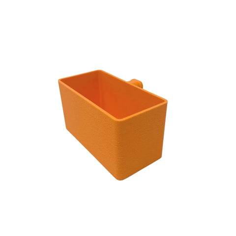 The BOGLETS Organizer Charm Accessory by Chatelet Manufacturing is a rectangular, textured orange organizer with an open top and side handle, designed to keep keys or personal items handy with your tote bag. Compatible with Bogg Bags. Shown on white background.