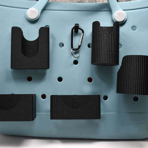 Chatelet Manufacturing’s BAGLETS Premium Collection Ultimate Bundle in black includes a phone case holder, key & wallet holder, carabiner key holder, bottle holder accessory, and sunglasses holder for Bogg bags and other totes.