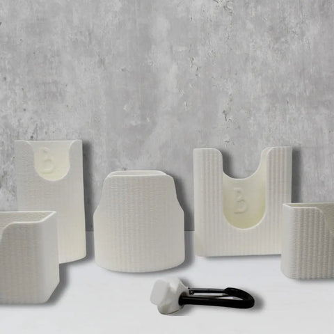 The Chatelet Manufacturing BAGLETS Premium Collection Ultimate Bundle includes five white tote accessories—phone case holder, key & wallet holder, carabiner key holder, bottle holder, and sunglasses holder—perfect for Bogg Bags and other totes.