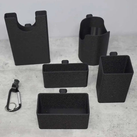 The BAGLETS Ultimate Bundle by Chatelet Manufacturing includes black phone, key, wallet, bottle, and sunglasses holders plus a black and silver Carabiner Key Holder—versatile accessories for Bogg Bags & other totes.