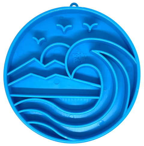 The SodaPup Baja Design ETray Enrichment Slow Feeder Tray for Dogs in light blue features raised wave, mountain, and bird designs, ideal for spreading treats to promote slow eating and enrichment.