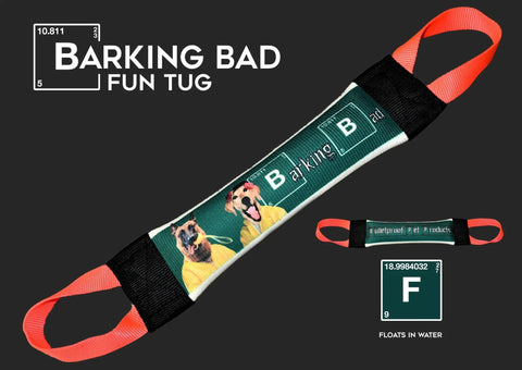The Barking Bad Fun Fire Hose Training Tug by Bulletproof Pet Products Inc features two dogs in yellow suits, black and red handles, and a green periodic table background—making it a durable and fun toy for dog training.