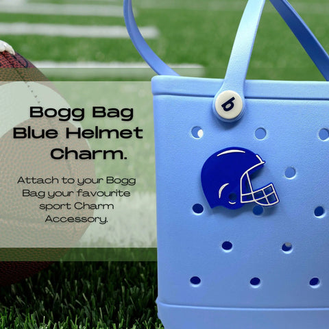 A light blue rubber beach bag with a blue football helmet BOGLET—one of Chatelet Manufacturing’s Sport Charms—rests on turf by a football. Text overlay invites you to customize your bag for game day with BOGLETS accessories.