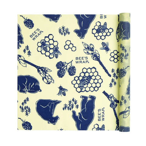 Bees Wrap Roll is a reusable beeswax food wrap featuring navy blue bears, bees, honeycombs, raspberries, and trees on a yellow background—an eco-friendly plastic wrap alternative with BEES WRAP in the design.