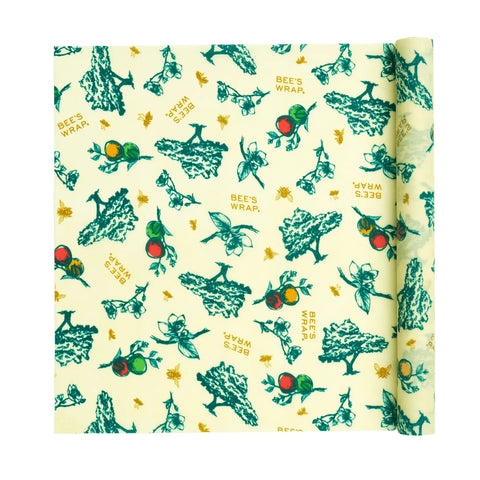 Bees Wrap Roll is a reusable beeswax food wrap, ideal for replacing plastic wrap, featuring green and red fruit, green trees, bees, and “BEES WRAP” on a light yellow background.