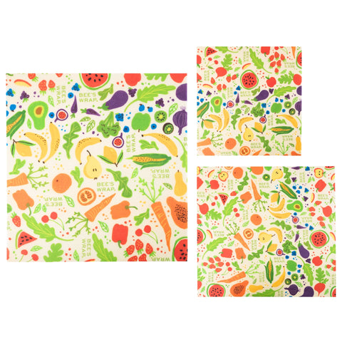 The Bees Wrap Assorted 3 Pack includes three beeswax wraps in various sizes, each featuring vibrant fruit and vegetable designs for a plastic-free way to keep food fresh.
