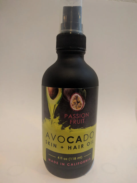 Bella Vado Avocado Oil Skin & Hair Oil (4oz) in a black bottle, made in California, features avocado and passion fruit images—ideal as a nourishing moisturizer or hair treatment.