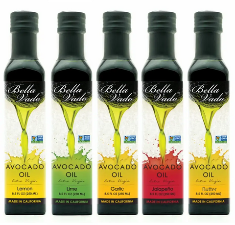 Five bottles of Bella Vado Avocado Oil Extra Virgin Avocado Oil (250 ml) in Lemon, Lime, Garlic, Jalapeño, and Butter flavors. Each features a green avocado graphic for a fresh twist on extra virgin avocado oil.