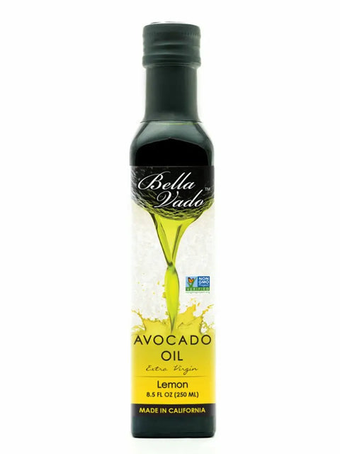 An 8.5 fl oz (250 ml) bottle of Bella Vado Avocado Oil Extra Virgin, with a black and yellow label featuring a green avocado graphic and text indicating it’s made in California.