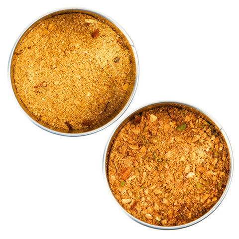 Elevate your dishes with the Gustus Vitae Better Than Butter Seasoning Set: 2 Pack—two round tins of golden brown Honey Butter and Garlic Butter blends, perfect for adding rich, buttery flavor to any meal.