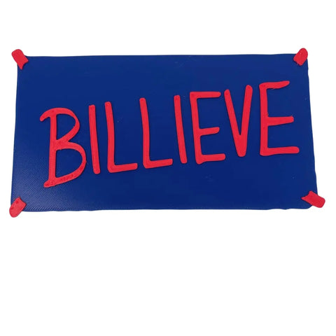 A Chatelet Manufacturing Billieve Motivational Wall Hanging, ~12x6 hard plastic in team colors, is perfect locker room wall art for sports fans.