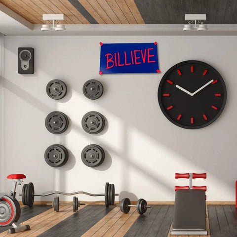 A modern gym room with benches, weights, and an exercise bike features the Chatelet Manufacturing Billieve motivational locker room wall sign (~12x6)—a perfect sports fan gift and decor in bold team colors.