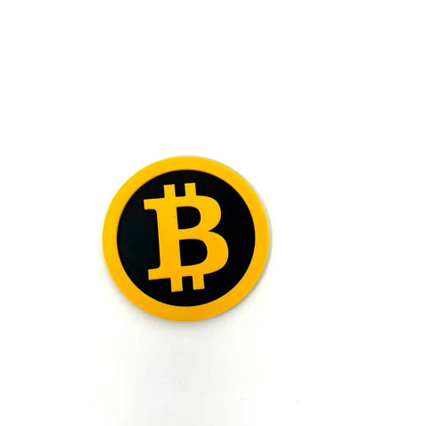 The Chatelet Manufacturing Bitcoin Fridge Magnet is a round, yellow and black decorative magnet, shown on a white background—ideal for cryptocurrency fans seeking unique fridge decor.
