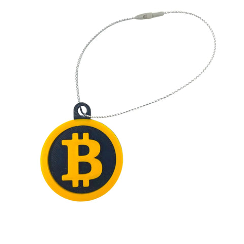 The Bitcoin Christmas Ornament by Chatelet Manufacturing features a yellow Bitcoin symbol on black, attached to a metal wire loop—perfect for cryptocurrency fans and holiday decor. Made in the USA.