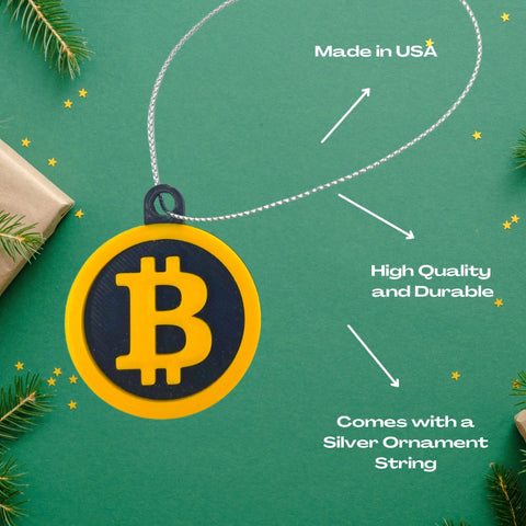 The Chatelet Manufacturing Bitcoin Christmas Ornament features a yellow and black design with a durable silver string. Made in the USA, this holiday ornament is perfect for cryptocurrency fans and decorative holiday displays.