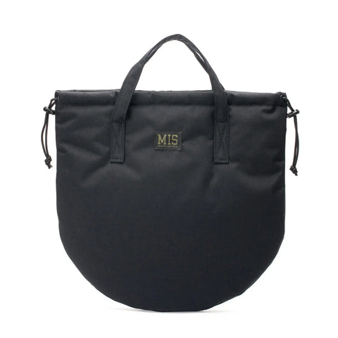 The MIS UK Helmet Bag - Black is a water-resistant, semi-circular tote with short handles and side drawstrings. It features a minimalist design and a front patch with MIS in yellow lettering.