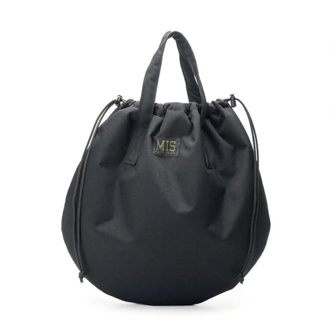 The MIS UK Helmet Bag in black features a round shape, two short handles, front logo patch, water-resistant fabric, soft slouchy design, adjustable side cords, and ample space for essentials.
