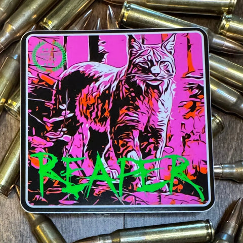 The American Lictor Sticker: Bobcat - Reaper is a vibrant 3x3 sticker with a bold pink and orange bobcat, bullets, and REAPER in large green letters across the bottom.