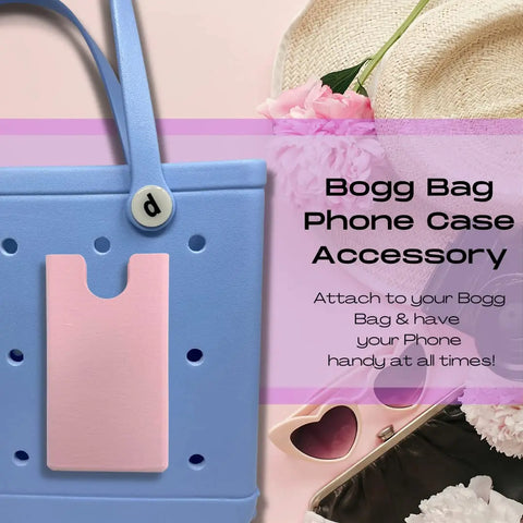 A pastel blue Bogg Bag tote with a pink Boglets phone holder charm by Chatelet Manufacturing attached. Pink flowers, heart sunglasses, and keys are nearby. Text: Keep your phone handy with the Boglets accessory—Made in the USA!.