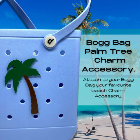 A BOGLETS - Bogg Bag BEACH Charm by Chatelet Manufacturing is shown on a blue tote with a palm tree charm, perfect for personalizing your bag with stylish decorative accessories. Ideal for adding flair to any beach bag.