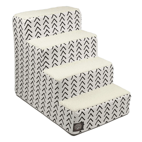 The Majestic Pet Boho Arrow 4 Steps Pet Stairs (Heavy-Duty) feature soft sherpa cushions, a black chevron design on the sides, and a machine-washable slipcover—ideal for helping pets reach higher surfaces with comfort and style.