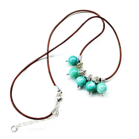 The Alexa Martha Designs Silver Green Blue Shell Bead Charm Leather Necklace is displayed on a white background.