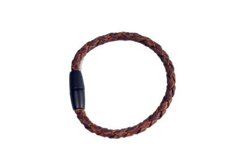 The Rogue Industries Rogue Braided Moose Leather Bracelet features brown moose leather and a black magnetic clasp, shown in a circular shape on a transparent background.