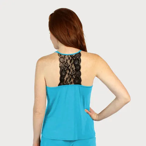 A woman with long red hair models the Goodnighties Lace Back Halter Top in turquoise, showing off its black lace upper back panel as she stands facing away from the camera, one hand on her hip, against a plain background.
