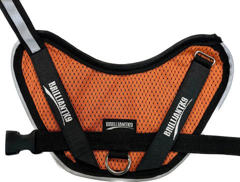 The BrilliantK9 Ergonomic Little Dog Harness for dogs 10lbs & under features an orange summer mesh with black trim and straps, soft dual-layer Jersey Mesh, and the white BrilliantK9 logo on the straps and label.