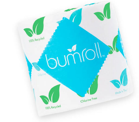 A roll of Bumroll Premium Toilet Paper by Bumroll, in white and blue packaging with green leaf icons, features its eco-friendly design: 100% recycled, chlorine free, made in the USA, and helps plant trees in the USA.