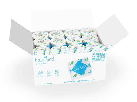 An open box of Bumroll Premium Toilet Paper (Bumroll) reveals 24 individually wrapped rolls with a blue and green leaf pattern. The box promotes its eco-friendly, recycled, and sustainable features and notes it plants trees in the USA.