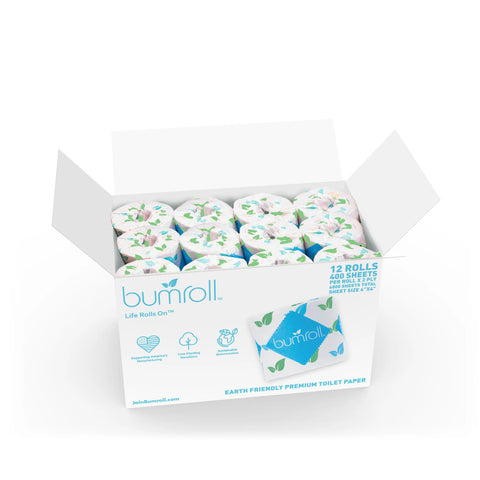 An open box of Bumroll Premium Toilet Paper (Bumroll) shows 12 leaf-patterned, individually wrapped 2-ply rolls. The packaging highlights recycled, sustainable materials and the fact that each purchase plants trees in the USA.