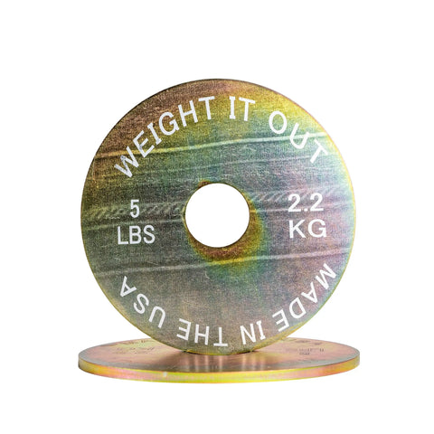 The Weight It Out Solid Steel Calibrated Weight Plate Pair features 5 LB (2.2 KG) plates labeled MADE IN THE USA, designed to stand upright and pair with Olympic bars or heavier 25 LB plates.