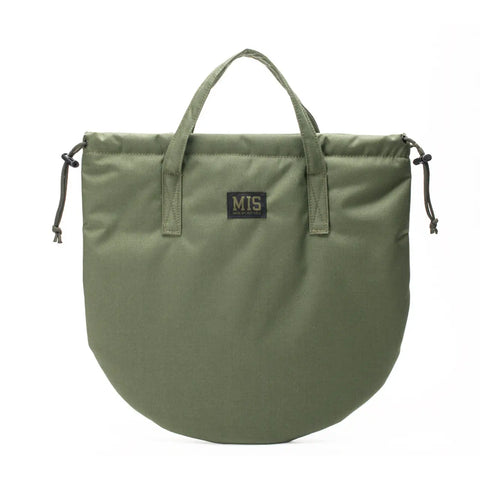 The MIS UK Helmet Bag in Camo Green features short handles, multiple pockets, side drawstring closures, and a black MIS patch on the front. Made of water-resistant Cordura Nylon, it is shown against a plain white background.