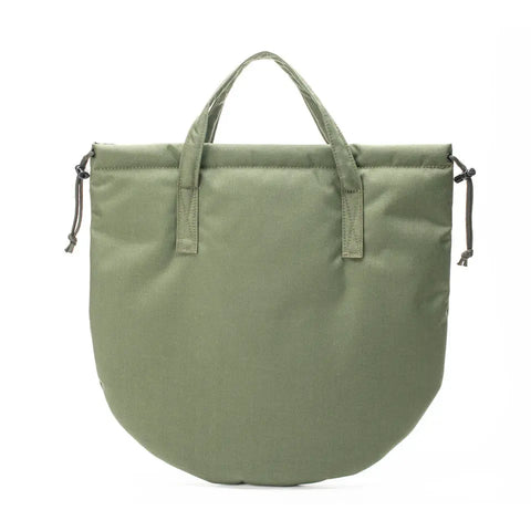 The MIS UK Helmet Bag - Camo Green is a water-resistant Cordura nylon tote with two short handles, a rounded bottom, and drawstring closures. Its minimalist, modern design makes it ideal for everyday use.