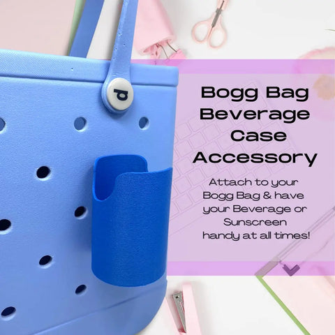 A blue Bogg Bag with a FRESHe BAGLETS Can Drink & Water Bottle Holder Charm Accessory by Chatelet Manufacturing attached. Text: FRESHe BAGLETS – keep drinks handy with your tote! Pink office items in the background.