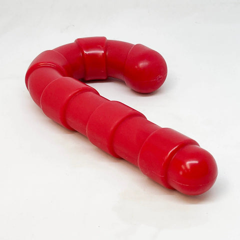 The SodaPup Candy Cane Ultra Durable Nylon Chew Toy is a red, segmented dog toy with rounded ends for power chewers, shown on a white background.
