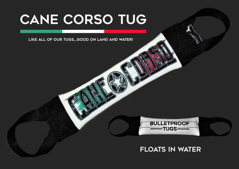 The Cane Corso Fire Hose Training Tug by Bulletproof Pet Products Inc is a heavy-duty black and white dog toy with handles. Text above reads CANE CORSO TUG. A smaller image shows the tug floating, highlighting land and water use.