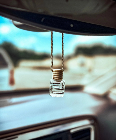 The Shanti + Tula Car Diffuser & Refill Set—a compact, stylish air freshener made in the USA—hangs from your rearview mirror, adding a premium touch and continuous fragrance to your car.