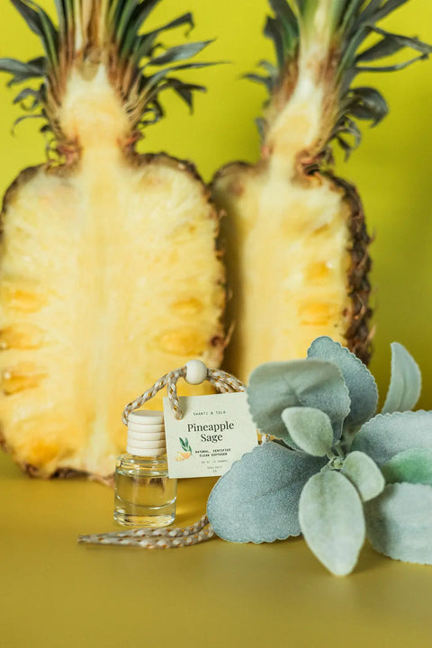 The Car Diffuser & Refill Set – Long-Lasting Hanging Air Freshener by Shanti + Tula features Pineapple Sage fragrance, blending soft green sage and fresh pineapple—perfect for your car and offered with easy refill options. Made in the USA.
