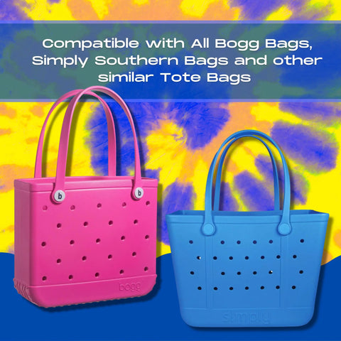 Two large rubber tote bags, one pink and one blue, are displayed on a yellow and blue tie-dye background. The Chatelet Manufacturing BAGLETS Carabiner & Plug Keys Holder is shown as the perfect USA-made accessory for securing keys in your tote bag.